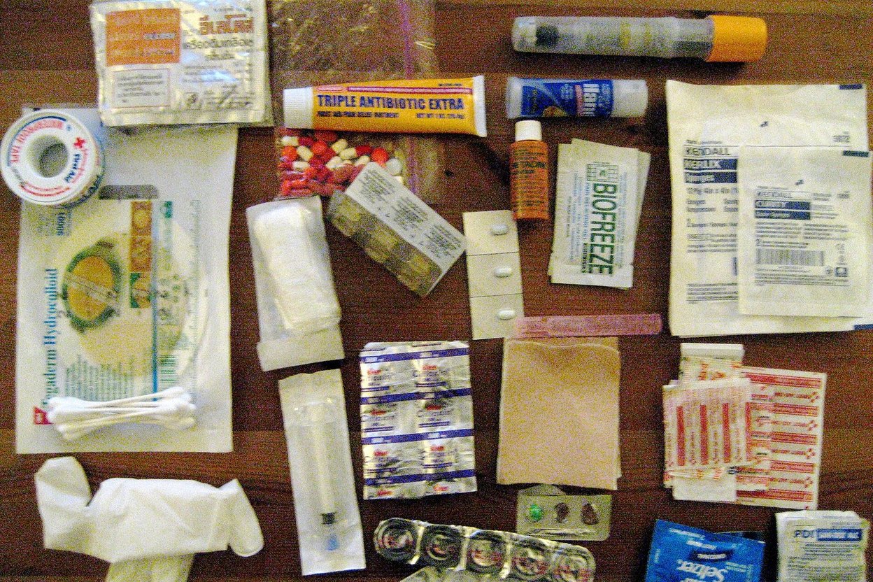 An emergency kit with water, food, flashlight and first-aid supplies