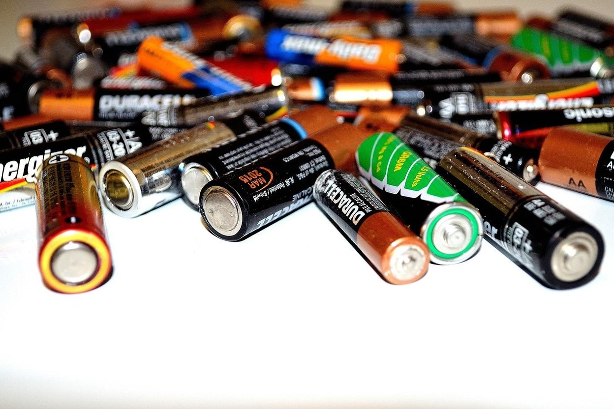 A pile of assorted household batteries