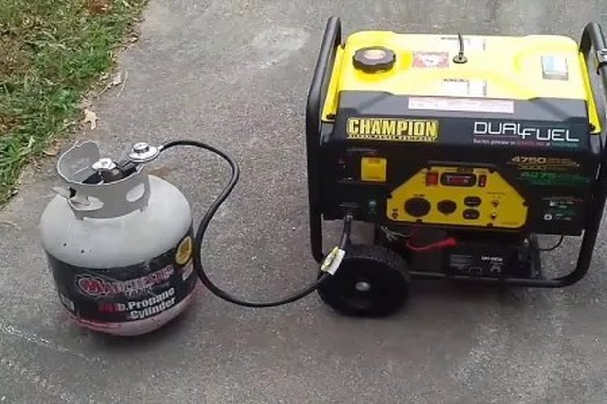 Yellow Champion Dual Fuel generator connected to a propane tank.