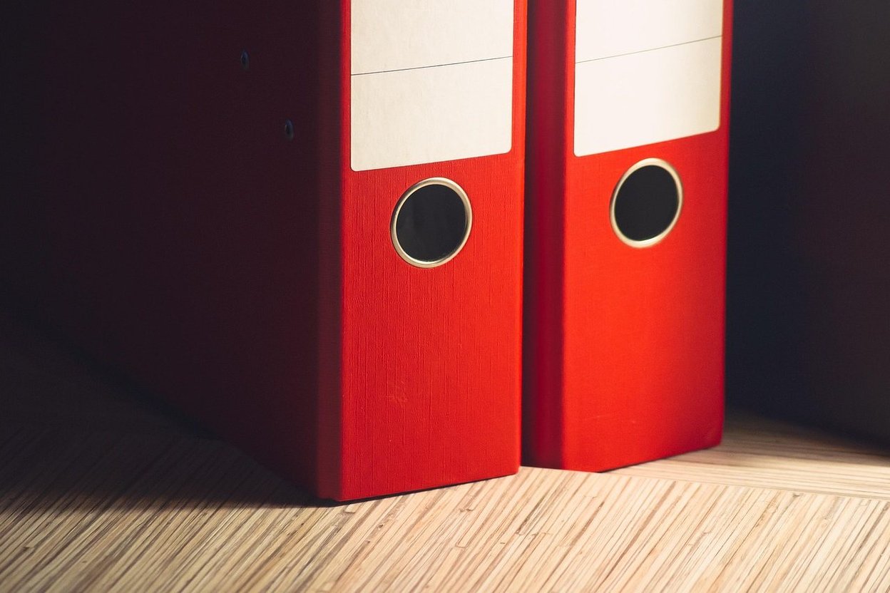 File folders and binders on a desk