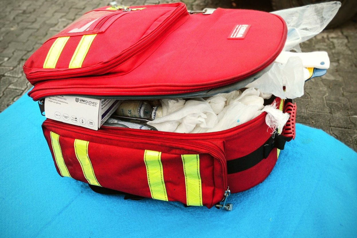A red first-aid kit bag