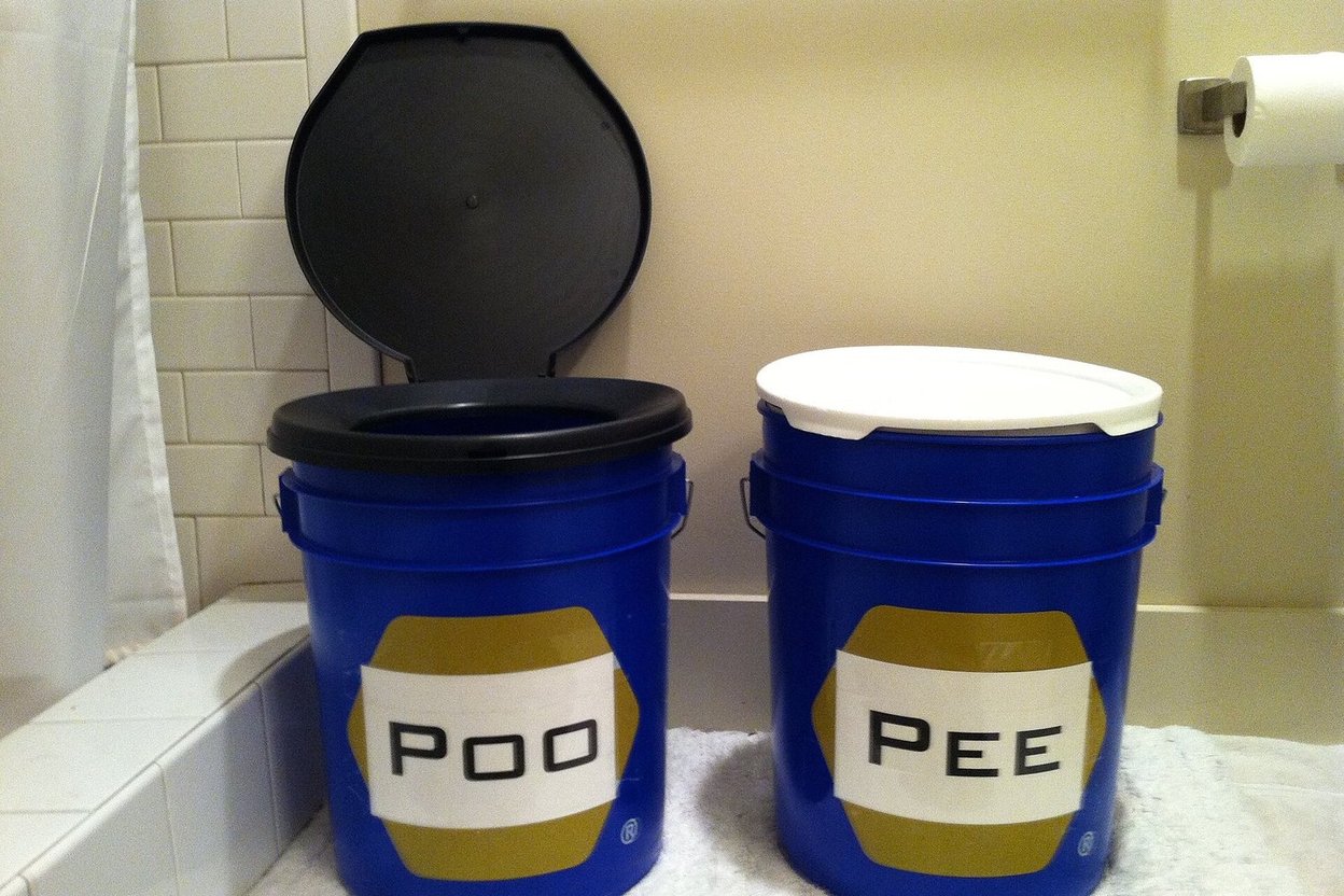 A two-bucket emergency toilet setup