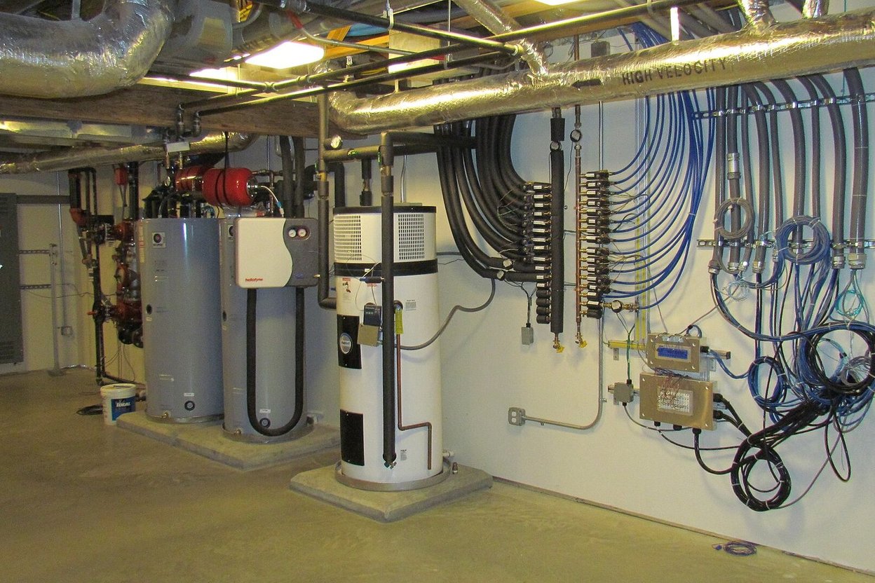 Water heaters and plumbing in a home basement