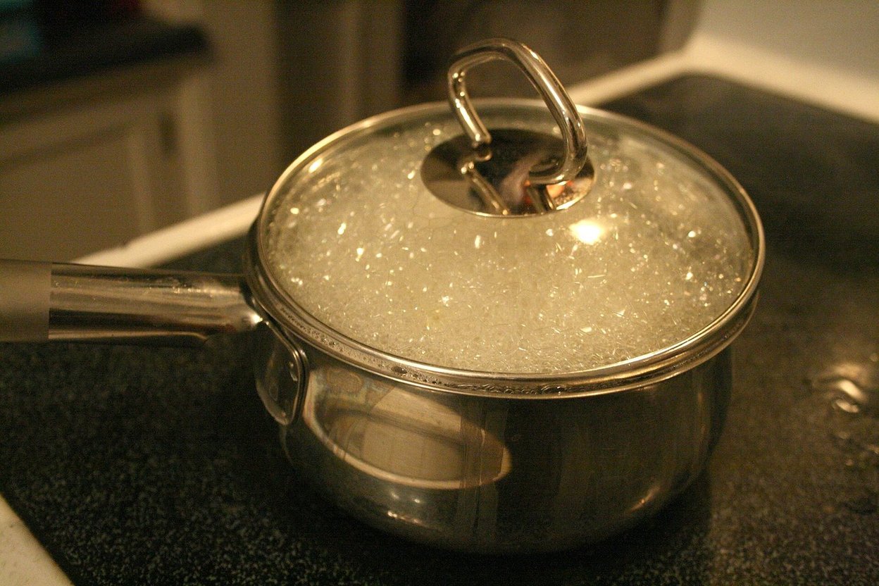 Water boiling in a cooking pot on a stove